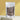 Cardamom seeds in eco-friendly pouch with yellow background
