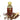 Bottle of clove oil with a scoop and cloves on a white background