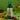 Bottle of Brooklane Heena Oil on a green background with heena powder and leaves.