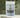 Wellness Brew in a soothing package with a mix of herbal ingredients and tea leaves in the background.