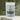 Wellness Brew in a soothing package with a mix of herbal ingredients and tea leaves in the background.